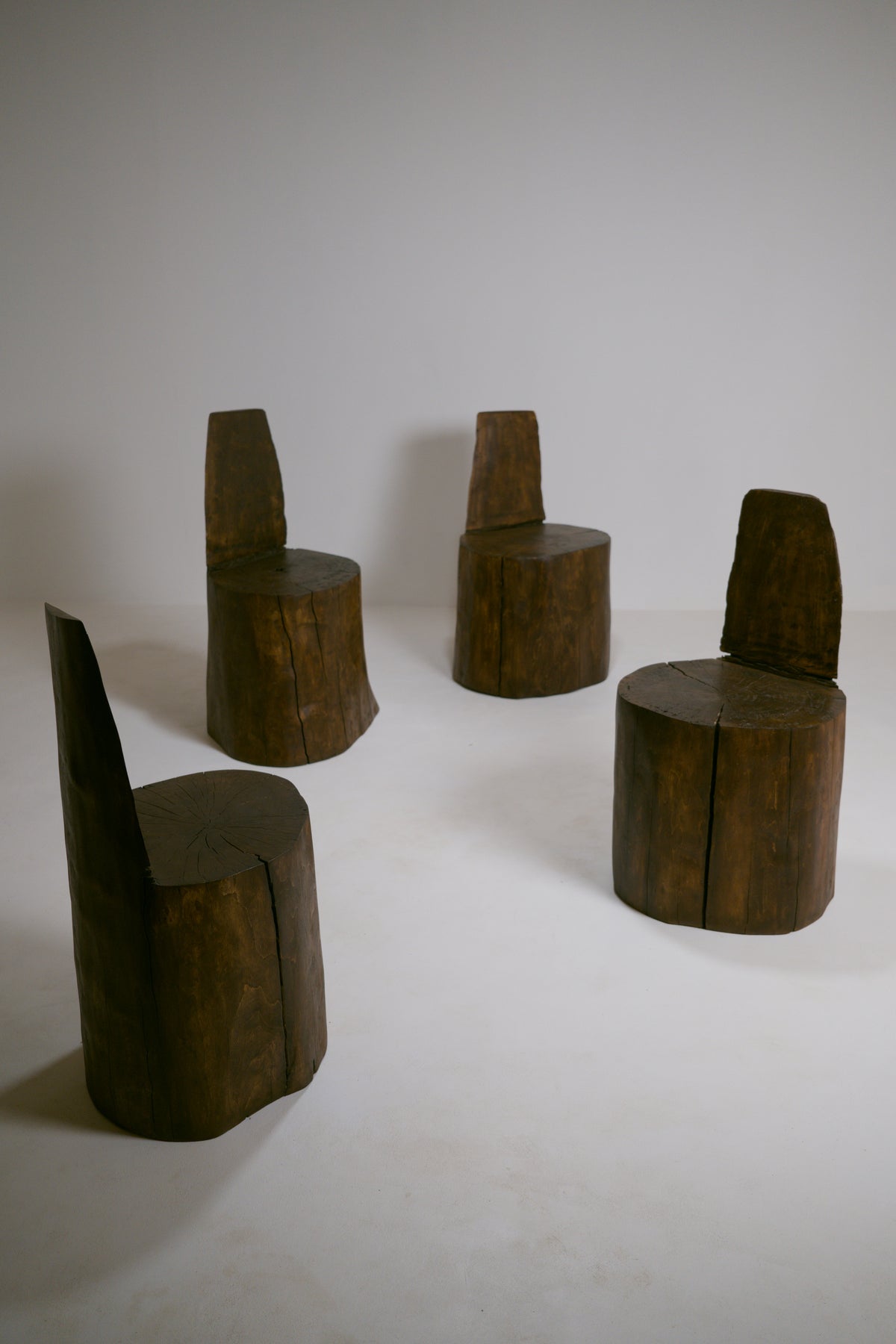 Set of four brutalist monoxyl armchair
